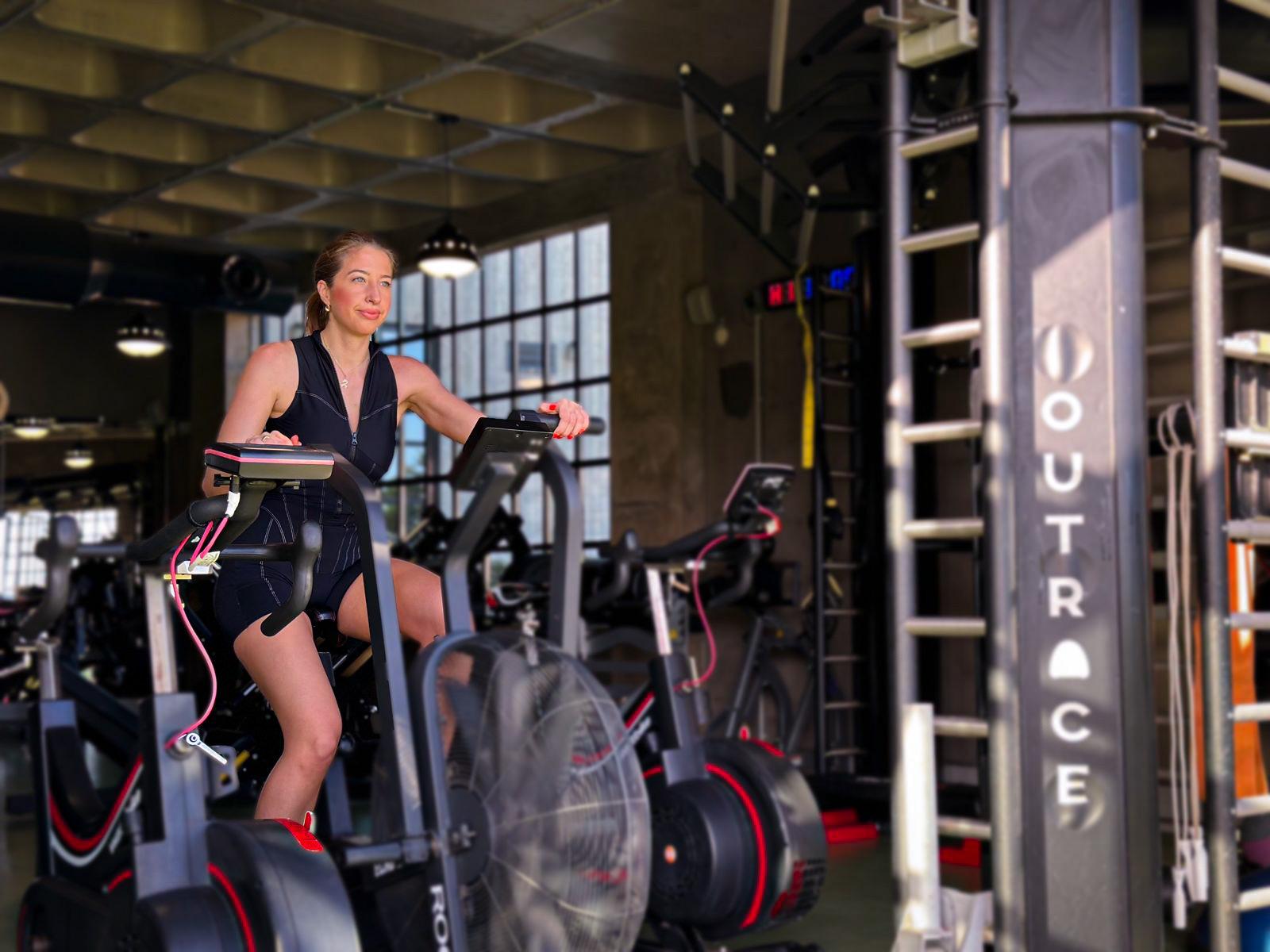 Sophia in the gym using a Power Bike.